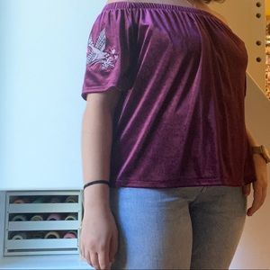 Loose fitting off the shoulder top with patches